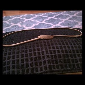 Gold tone stretch belt.